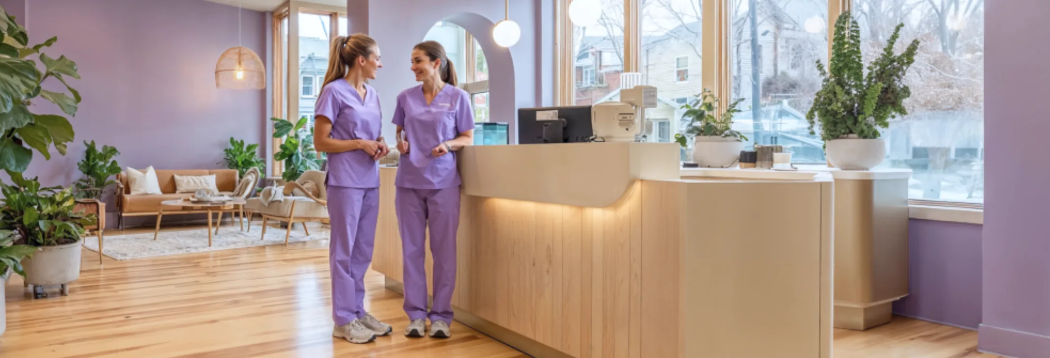 Dentalflow clinic reception with two staff members