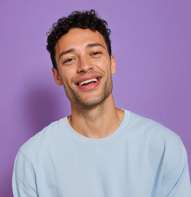 Smiling man in a light blue sweater
