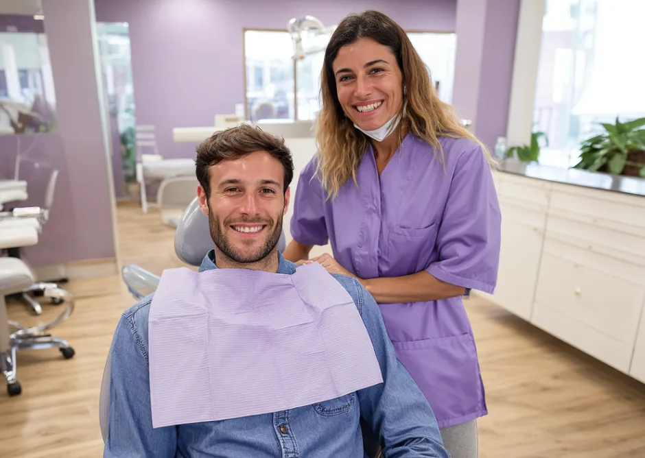 Dentist with a smiling patient in the chair